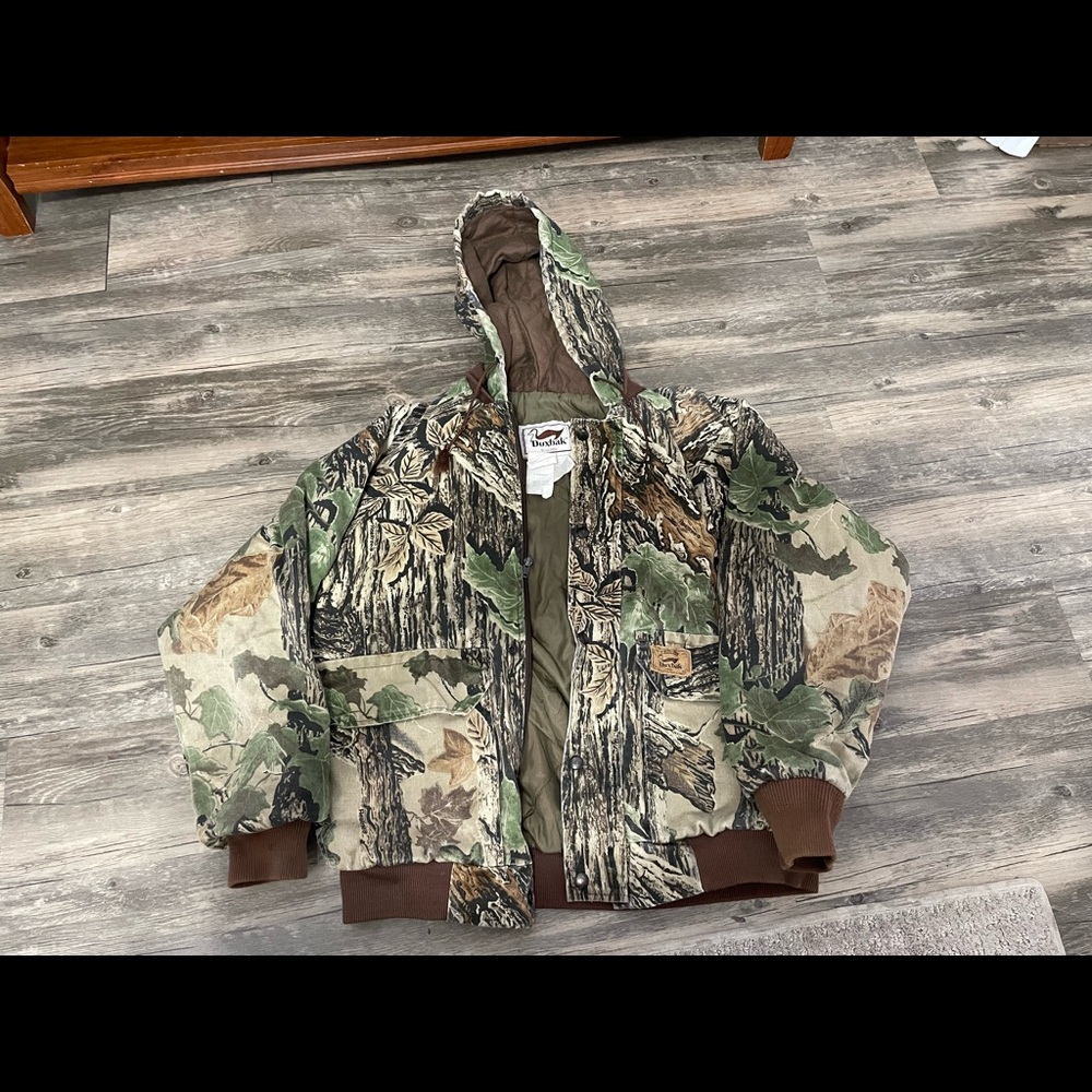 Camouflage real tree hunting coat. It’s says large but fits like a medium.